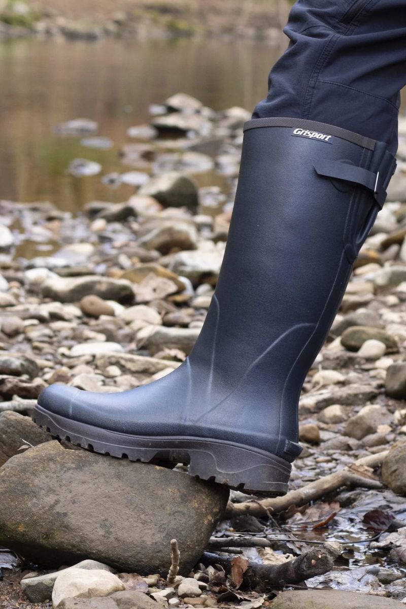 Dog walker wearing Grisport Stream Neoprene Wellington Boots in navy