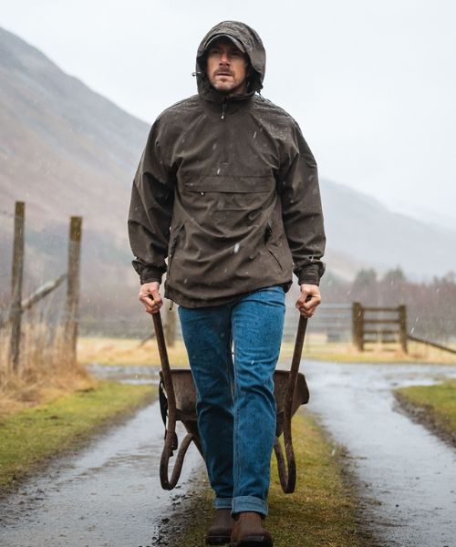 Gardeners Pulling Wheelbarrow Whilst Wearing Hoggs of Fife Struther Waterproof Smock
