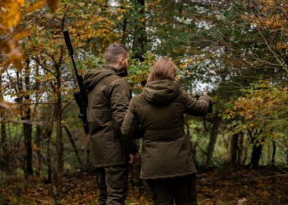 Deer stalking clothing worn in woodland setting