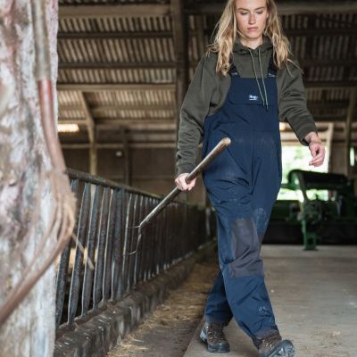 female farmer wearing waterproof bib and brace